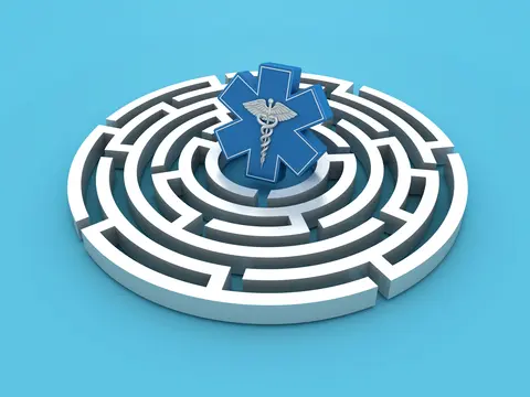 Blue medical symbol at center of white circular maze on light blue background.