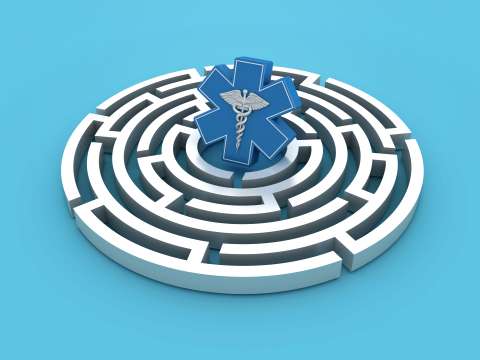 Blue medical symbol at center of white circular maze on light blue background.