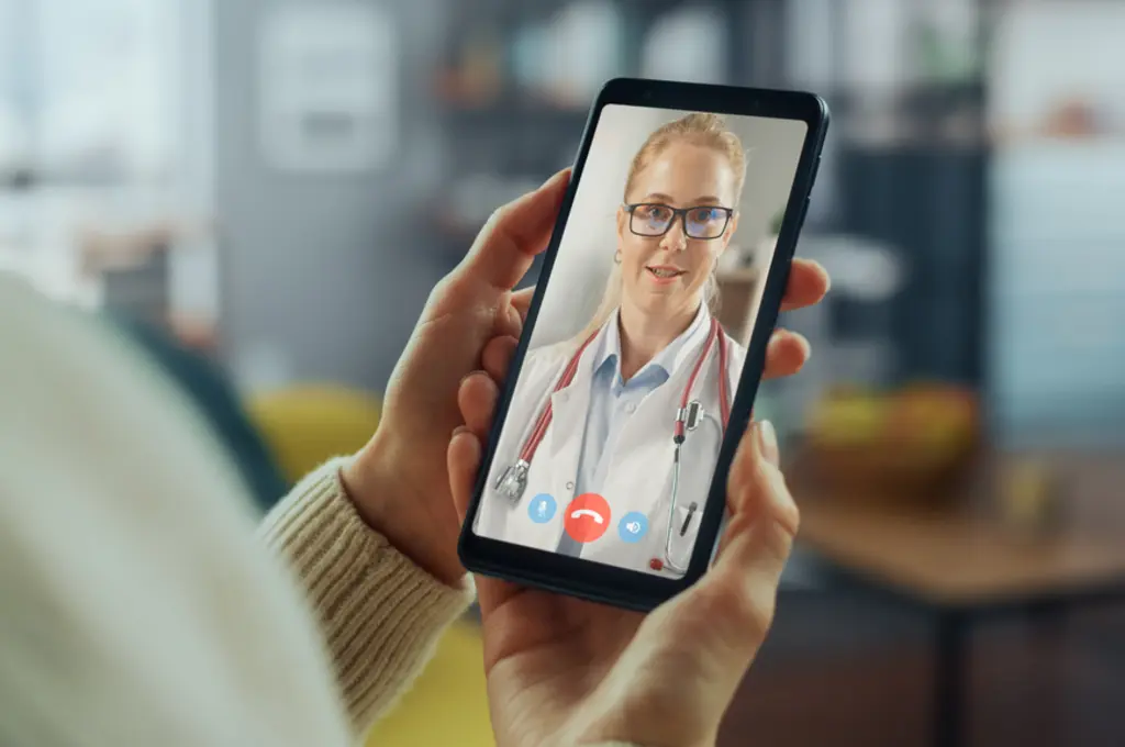 Patient meets with her doctor on a telemedicine call on her mobile phone