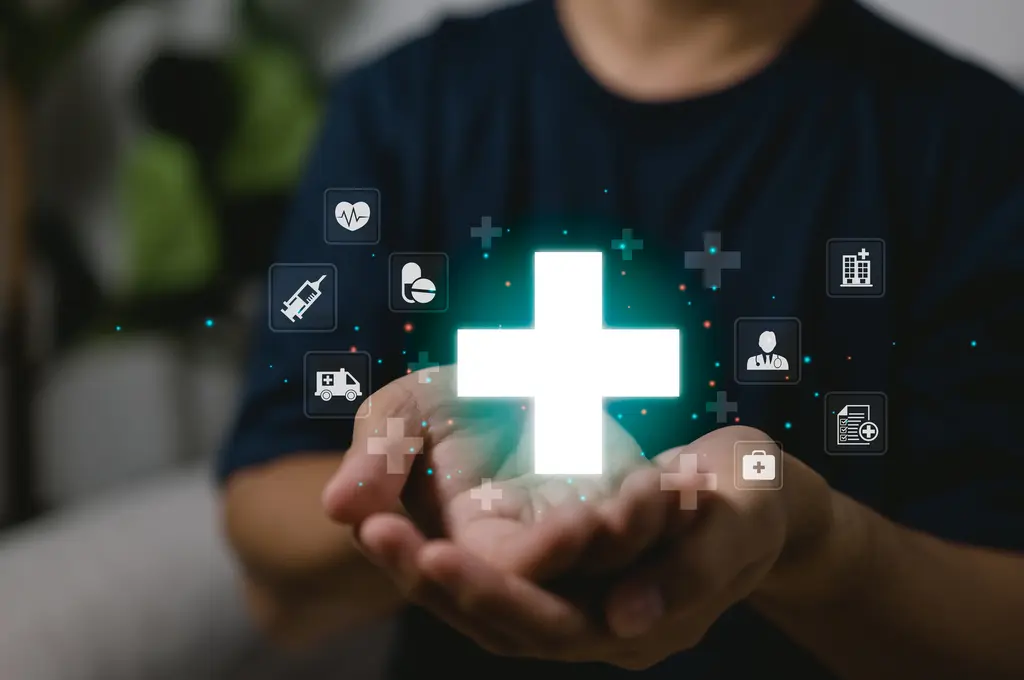 Hands holding a green glowing medical cross