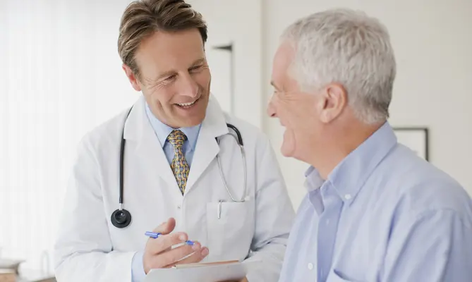 Doctor and patient in exam room for a physical