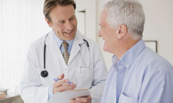 Doctor and patient in exam room for a physical