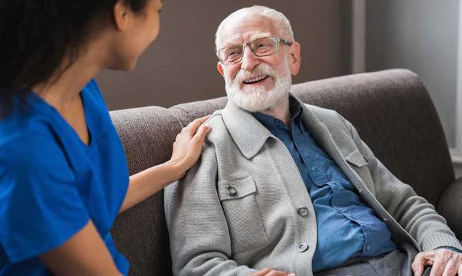 Three Rivers Concierge Medicine doctor comforting elderly male patient in St. Louis, MO