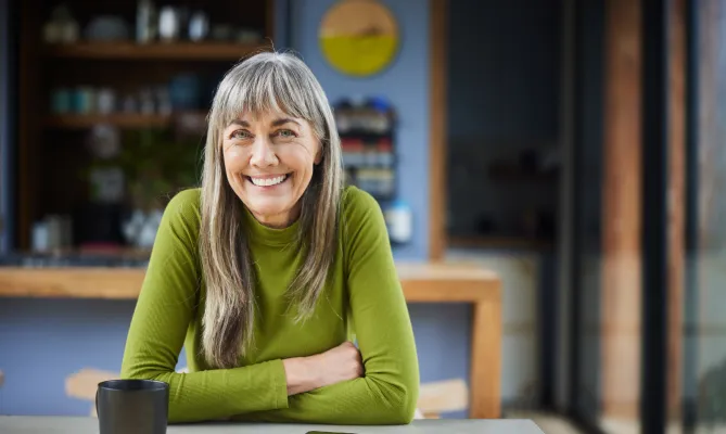 A smiling middle aged woman