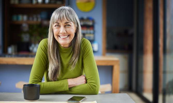 A smiling middle aged woman