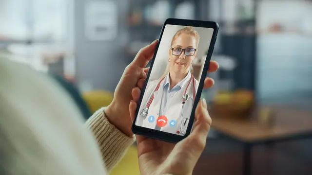 Patient meets with her doctor on a telemedicine call on her mobile phone