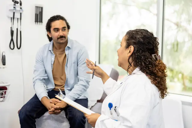 A doctor explaining something to her patient